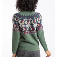 Person wearing a green sweater with a colorful pattern on a white background