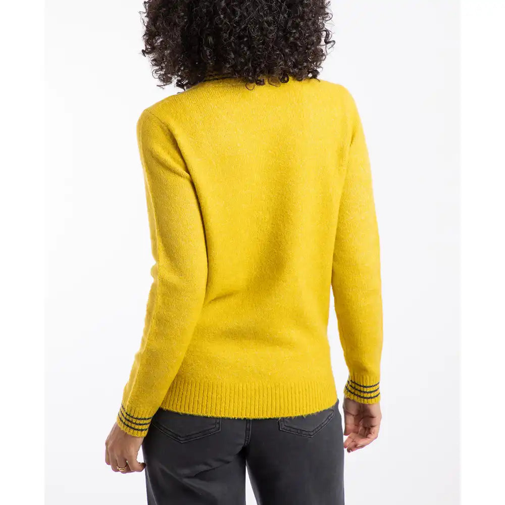 Person wearing a yellow sweater on a white background