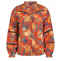 Floral patterned shirt with orange background on a white background