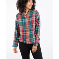 Woman wearing a plaid shirt on a white background