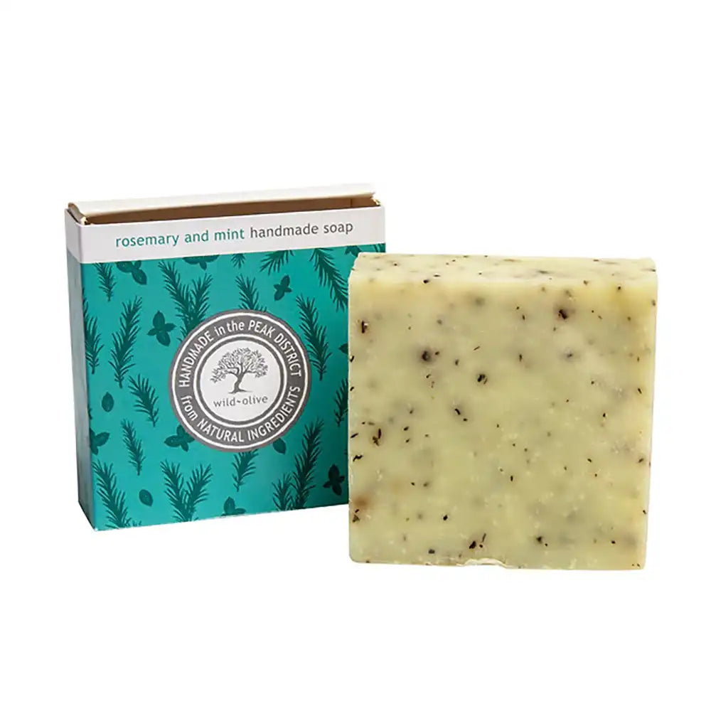 Bar of rosemary and mint handmade soap with a branded box on a white background