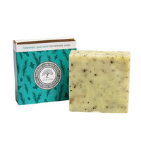 Bar of rosemary and mint handmade soap with a branded box on a white background