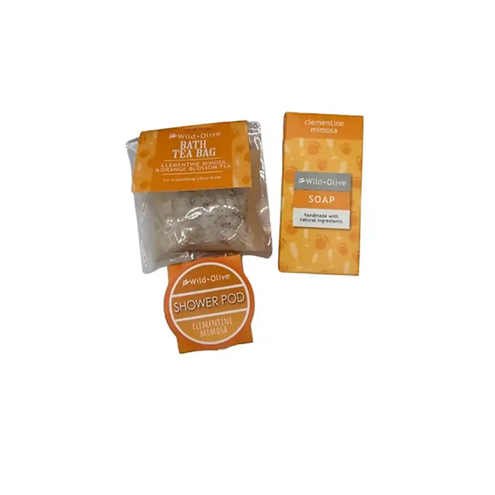 Wild-Olive Clementine Mimosa set featuring a bath tea bag, a soap bar, and a shower pod in orange and white packaging on a white background.