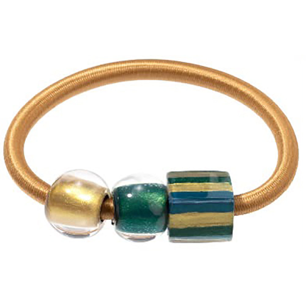 Gold coloured bangle with three beads, left to right, gold sphere bead, teal sphere bead and cube striped gold and teal bead
