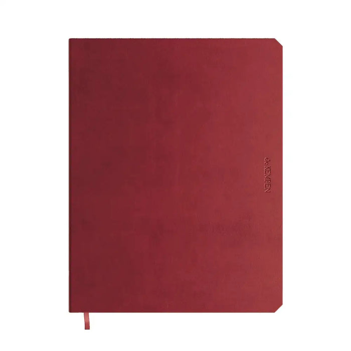 Red notebook with a visible brand logo on a white background