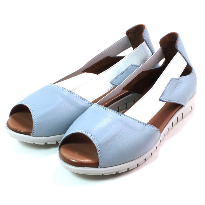 Adesso Polly sandals. Peep toe design with sky blue material. Metallic silver colour side bracing. White soles. Angled view.