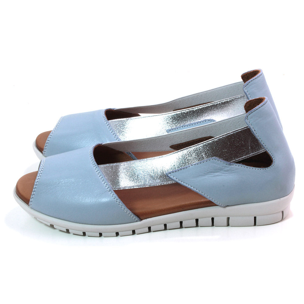 Adesso Polly sandals. Peep toe design with sky blue material. Metallic silver colour side bracing. White soles. Side view.