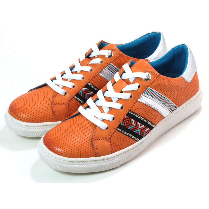 Adesso orange Sacha trainers with white soles and tribal pattern details. Angled view.