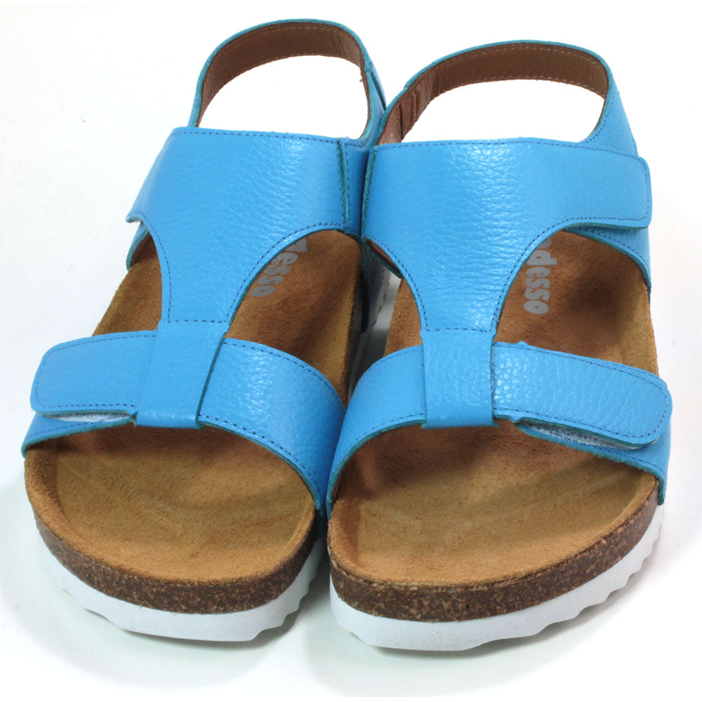 Adesso Tammy sandals with cork soles over white rubber base. Sky blue. Adjustment over toes and over the foot with Velcro. Heel strap. Front view.