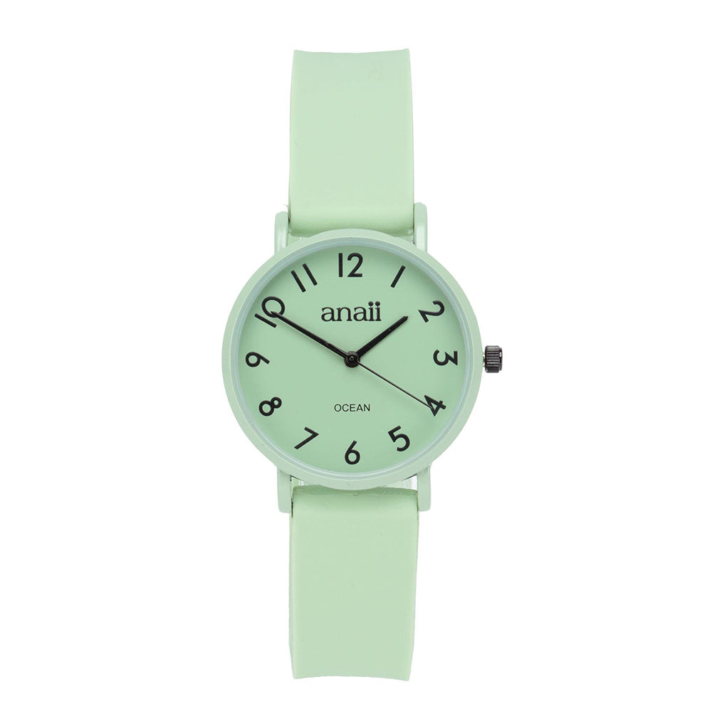 Pale green Anaii watch. Case, face and strap match. Black hands and numbers. Sweep second hand. Very clear face.