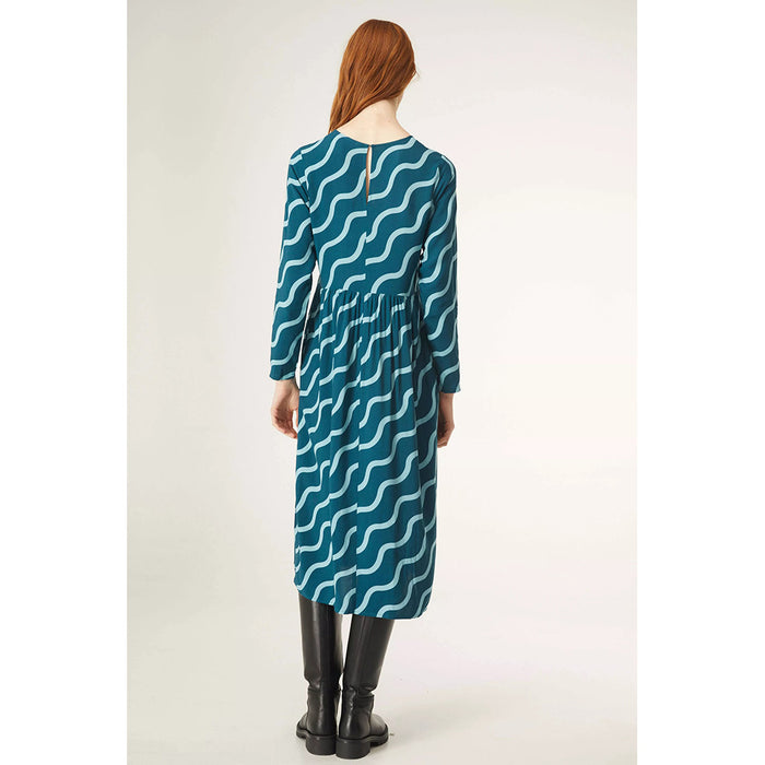 Compania Fantastica midi length blue dress with diagonal wave pattern. Long sleeves, high round neck. Back view showing single button keyhole fastening..