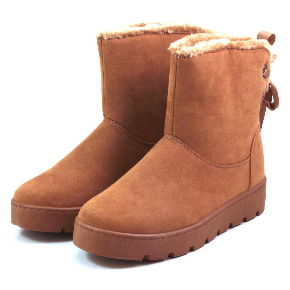 Emma Champery tan soft suede ankle boots with fur lining - Angled view