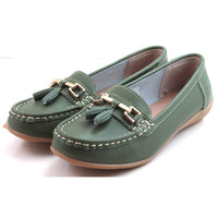 Jo and Joe Nautical mistletoe green moccasin style leather flat shoes. White stitching and green leather tassels. Angled view