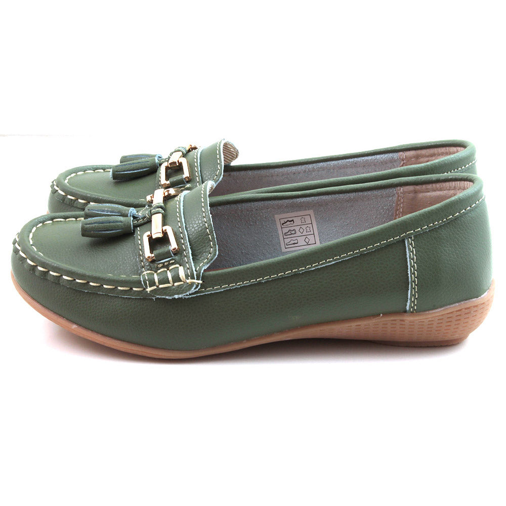 Jo and Joe Nautical mistletoe green moccasin style leather flat shoes. White stitching and green leather tassels. Side view