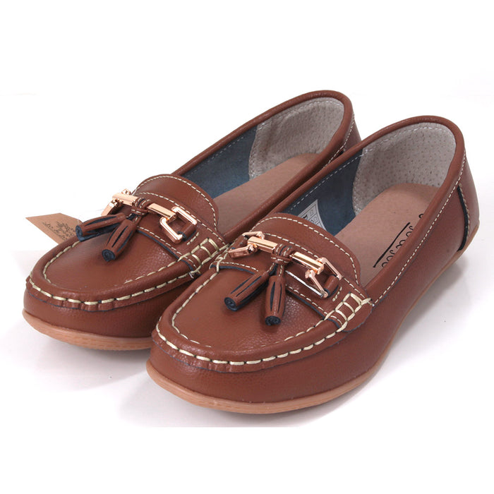 Joe and Jo moccasin style slip on, leather shoes in tan colour. Over the foot metallic gold coloured  detail and two matching tassels. Beige rubber soles. Angled view.