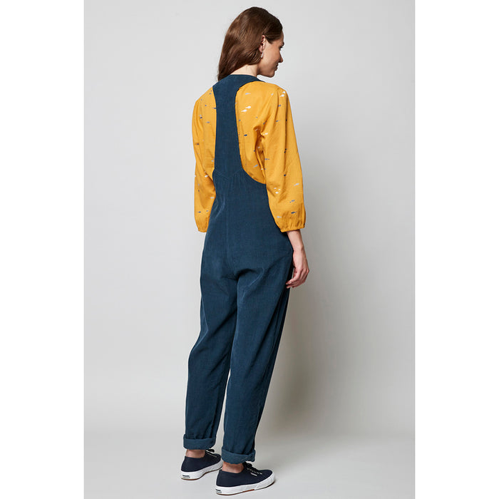 Nomads cord dark blue dungarees. Button fastening. Pockets and trouser turn-ups. Back view.