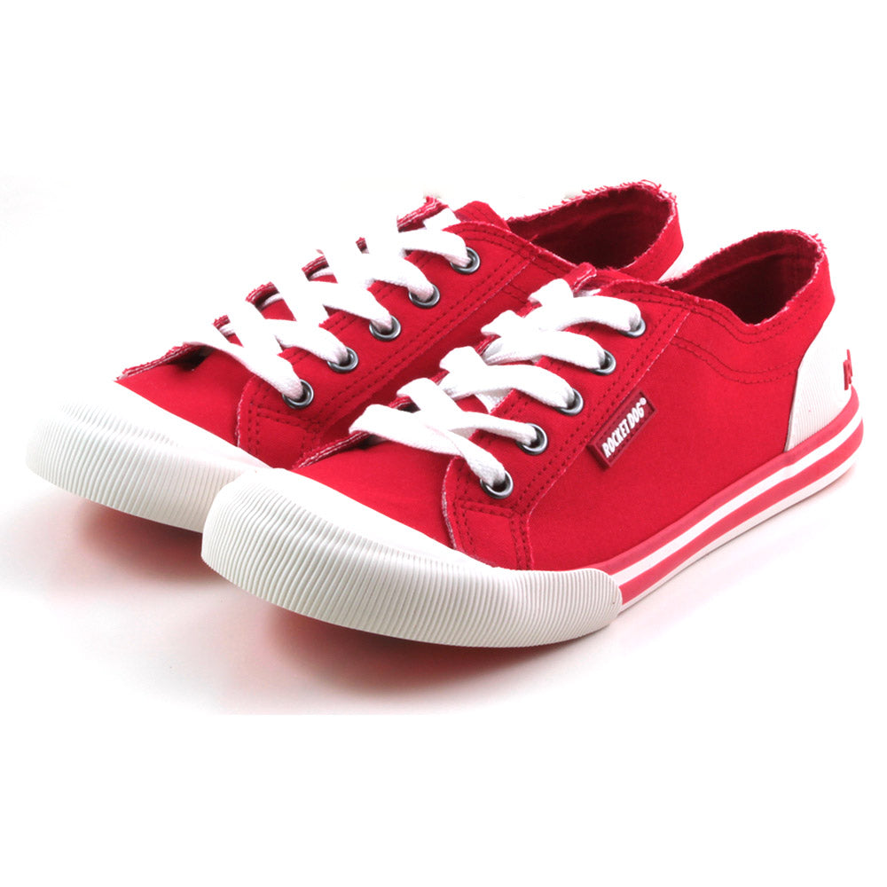 Rocket Dog Jazzin low rise trainers in red fabric. White rubber plimsole soles. White wide laces. Angled view.