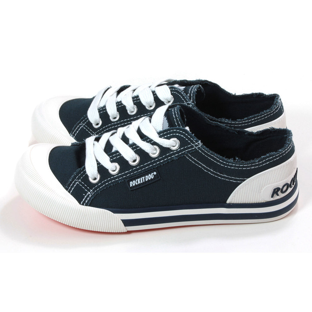 Rocket Dog Jazzin low rise trainers in navy blue fabric. White rubber plimsole soles. White wide laces. Side view.