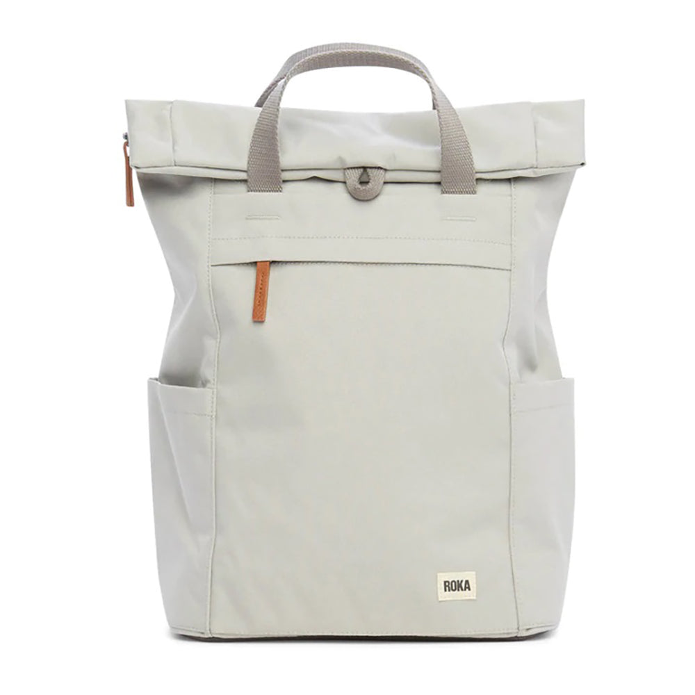 Roka light grey backpack. Foldover and zip fastening at the top. External zip fastening pocket. Grey handles and back pack straps. Two water bottle pockets.