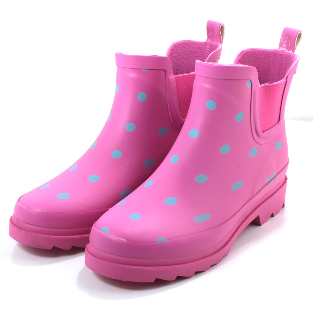 Urban Jack ankle wellingtons. Pink with grey spots. Fabric interior. Elasticated side gusset. Back pull on tabs. Angled view.